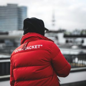person in red jacket and black knit cap